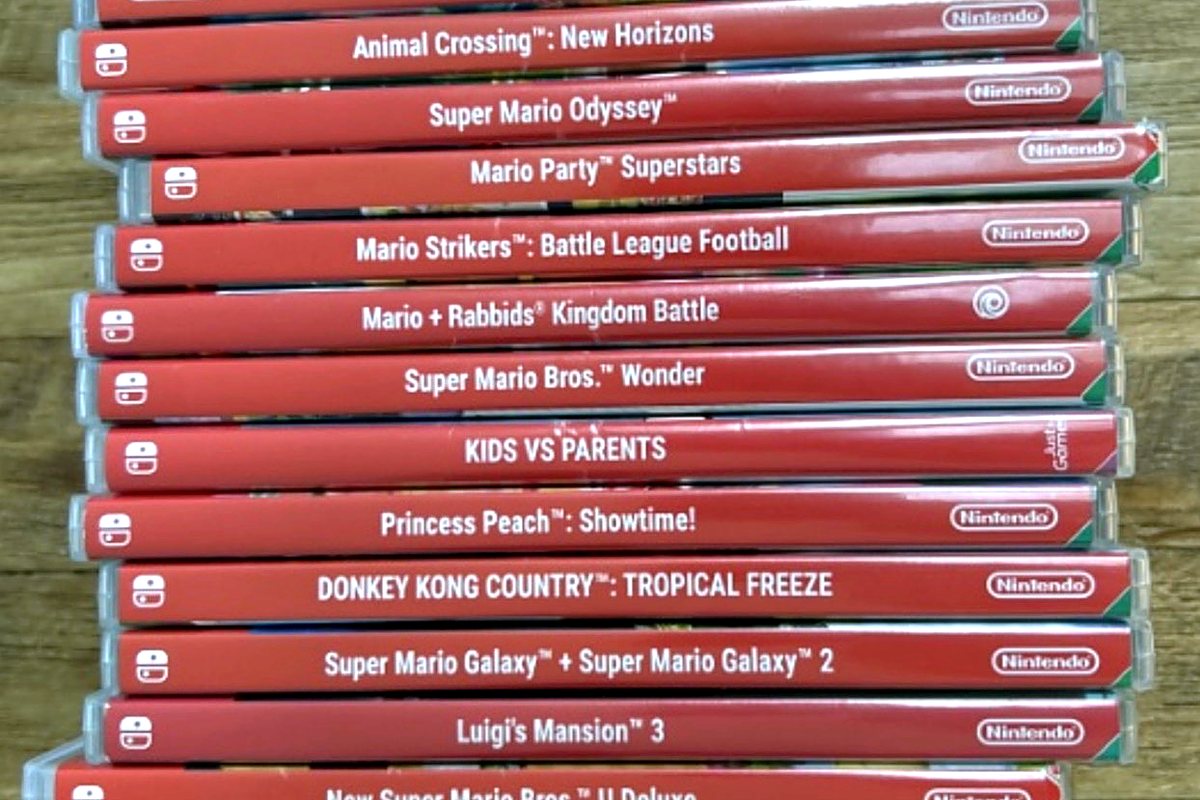 A stack of Nintendo Switch game cases including Super Mario Odyssey, Super Mario Bros. Wonder, and Princess Peach Showtime